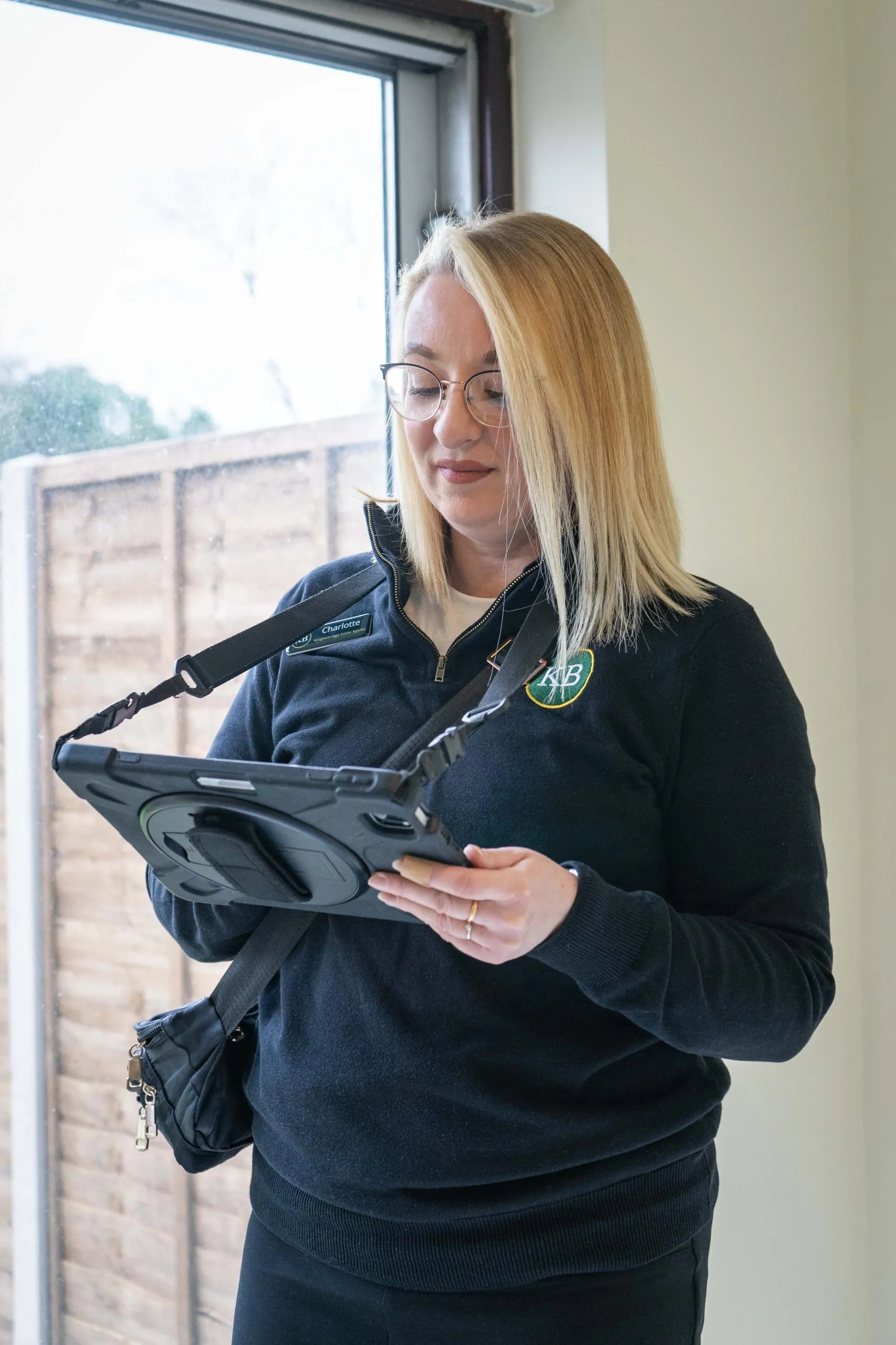 Lettings agent using a tablet to prepare an inventory