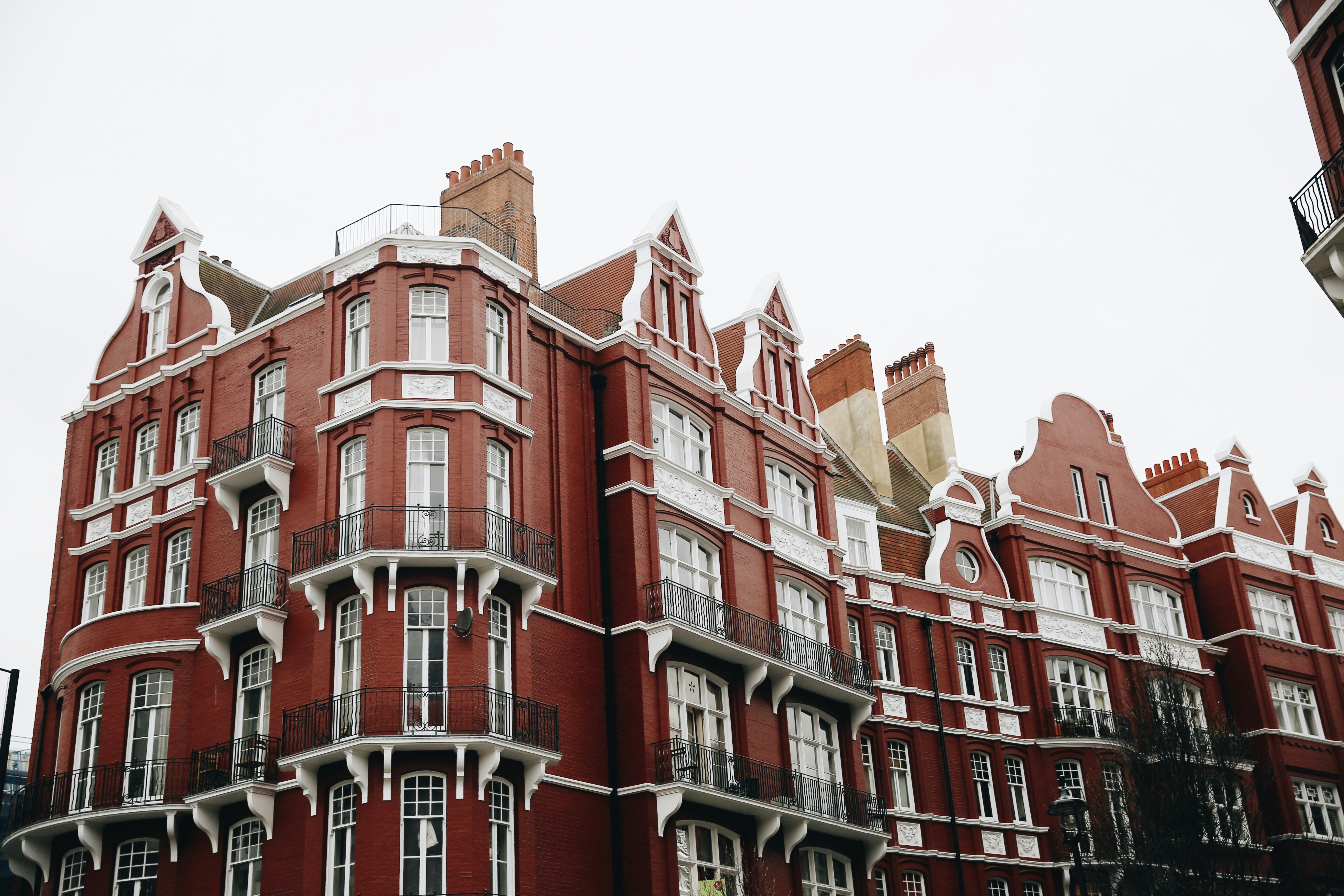 London apartment building with striking red brick facade and clean daytime lighting