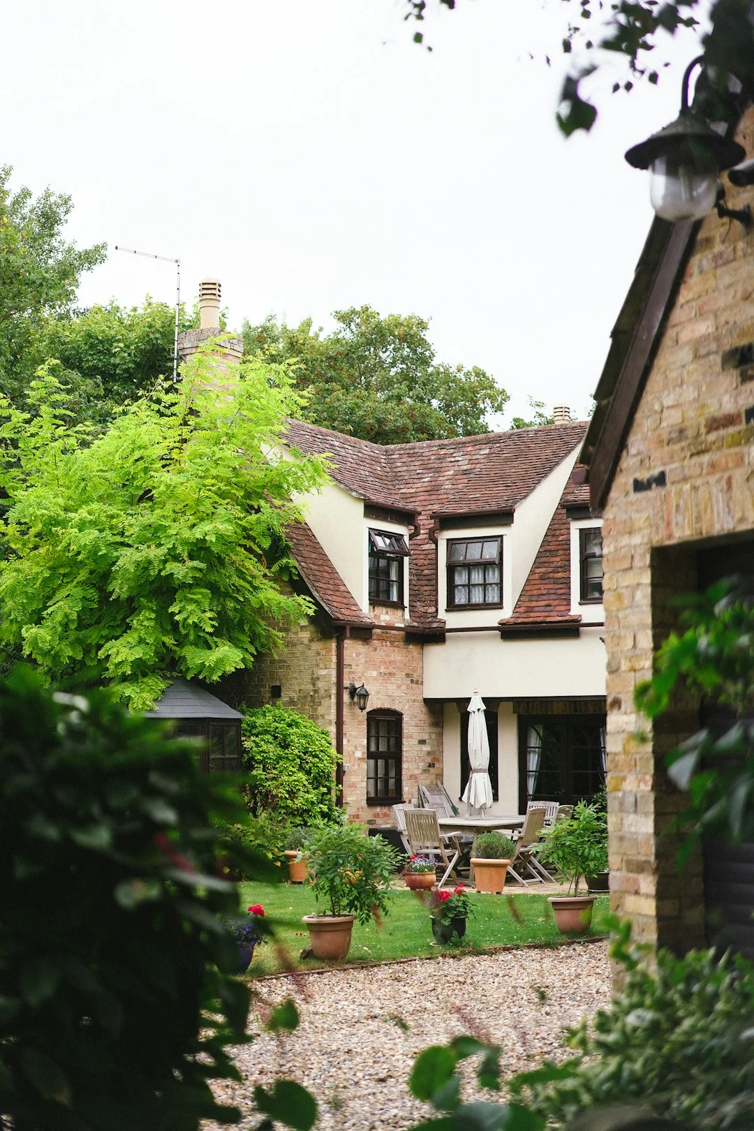Large house with extensive greenery and manicured landscaping