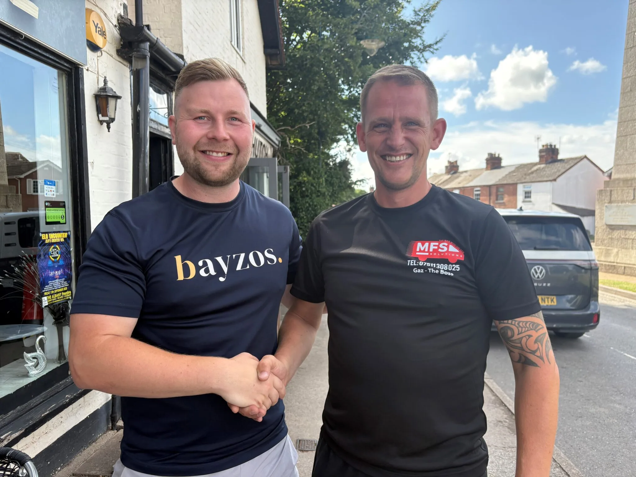 James from Bayzos estate agents stands next to the owner of MFS Solutions removal company. They are shaking hands
