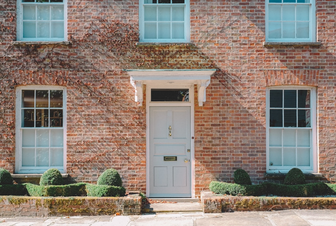 Traditional brick house with white wooden door and period features
