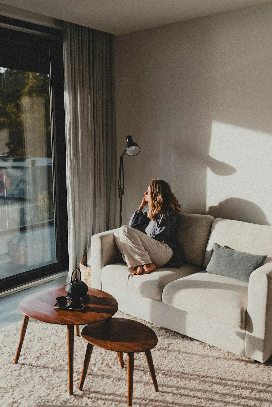 Person reading in a cosy home interior