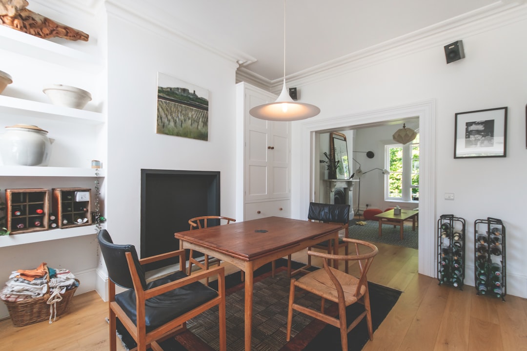 Wooden dining table and chairs in a warm home setting