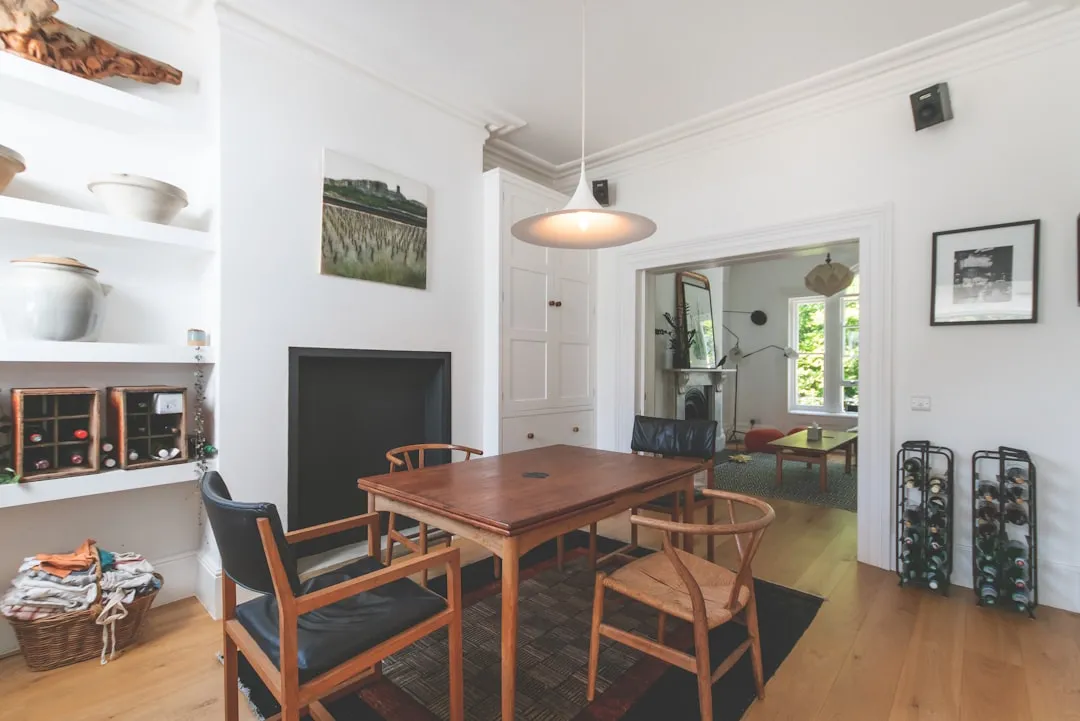 Wooden dining table and chairs in a warm home setting