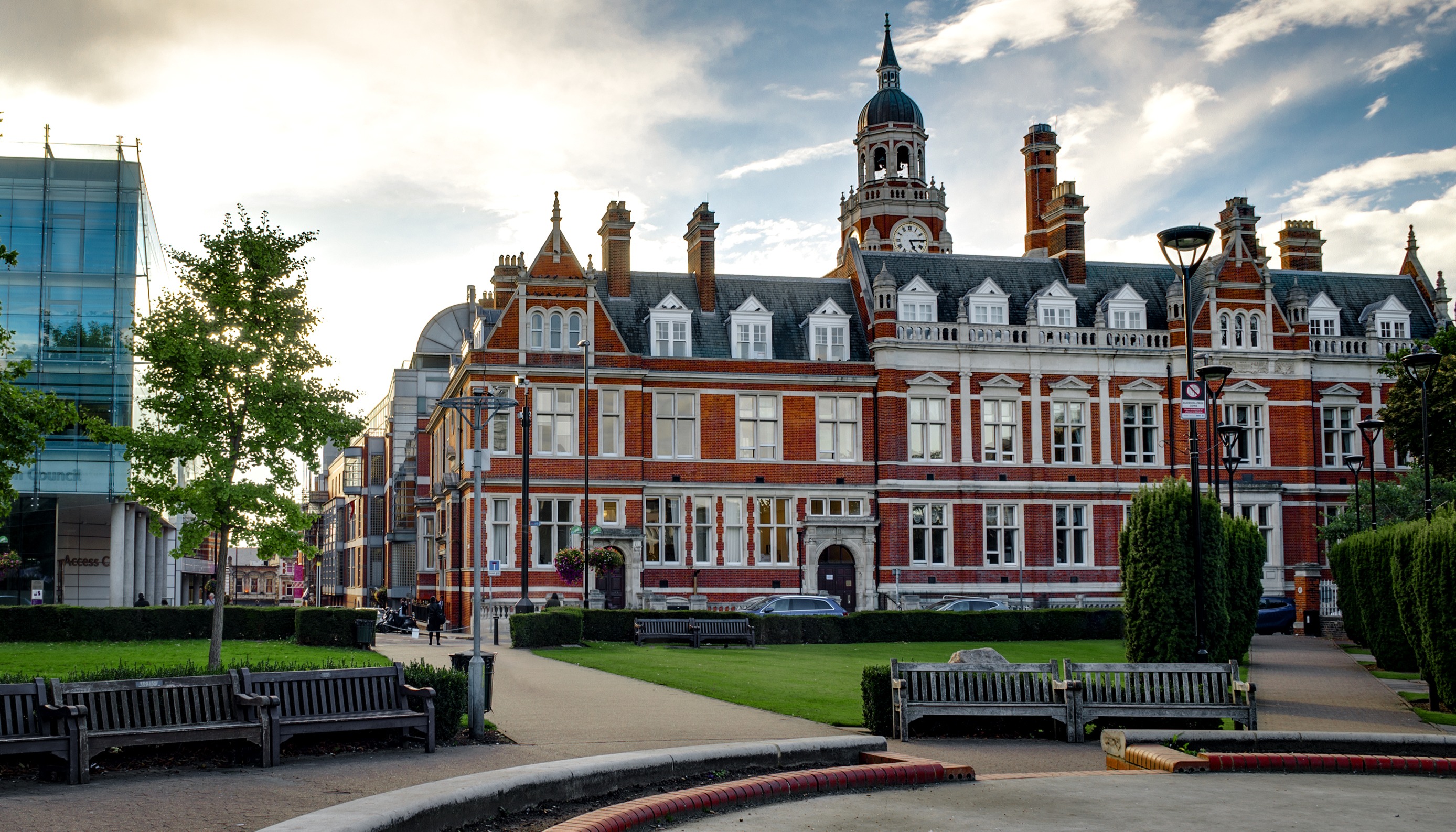 Croydon Town Hall — Victorian red-brick building with clock tower, manicured lawns, blue sky