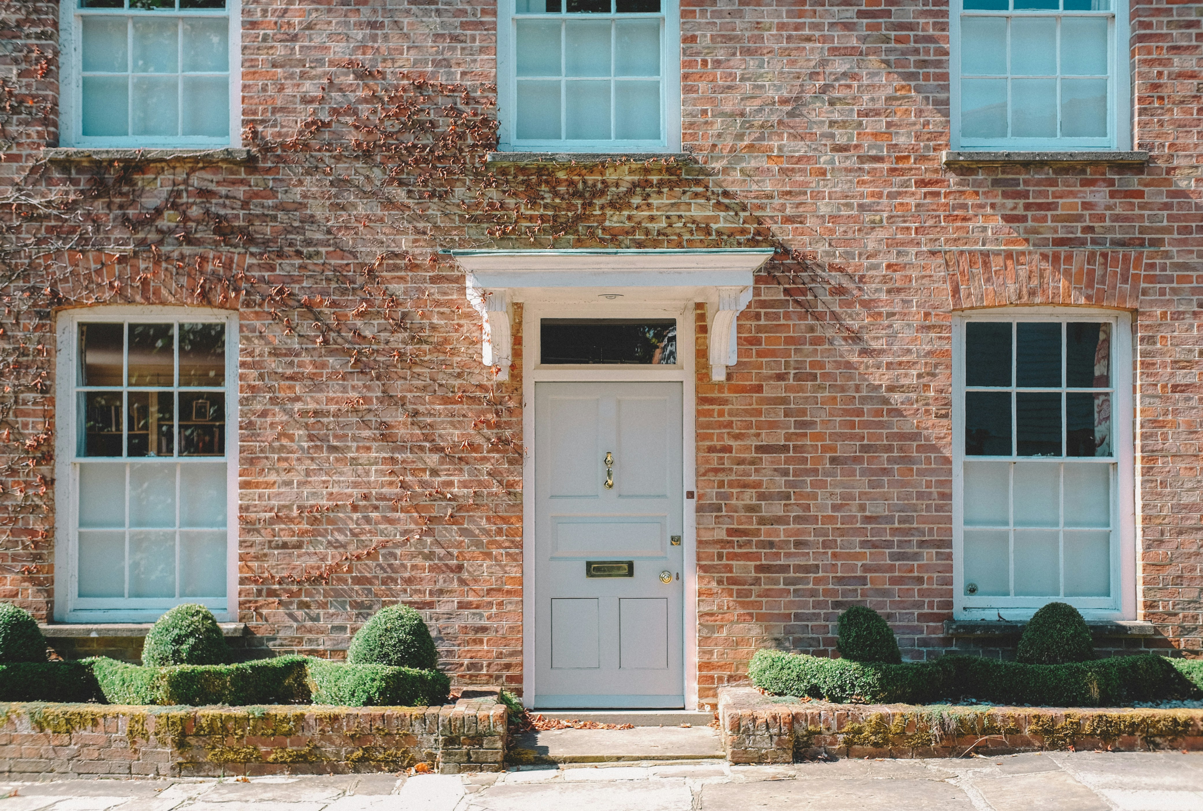 Classic brick terraced house with white door