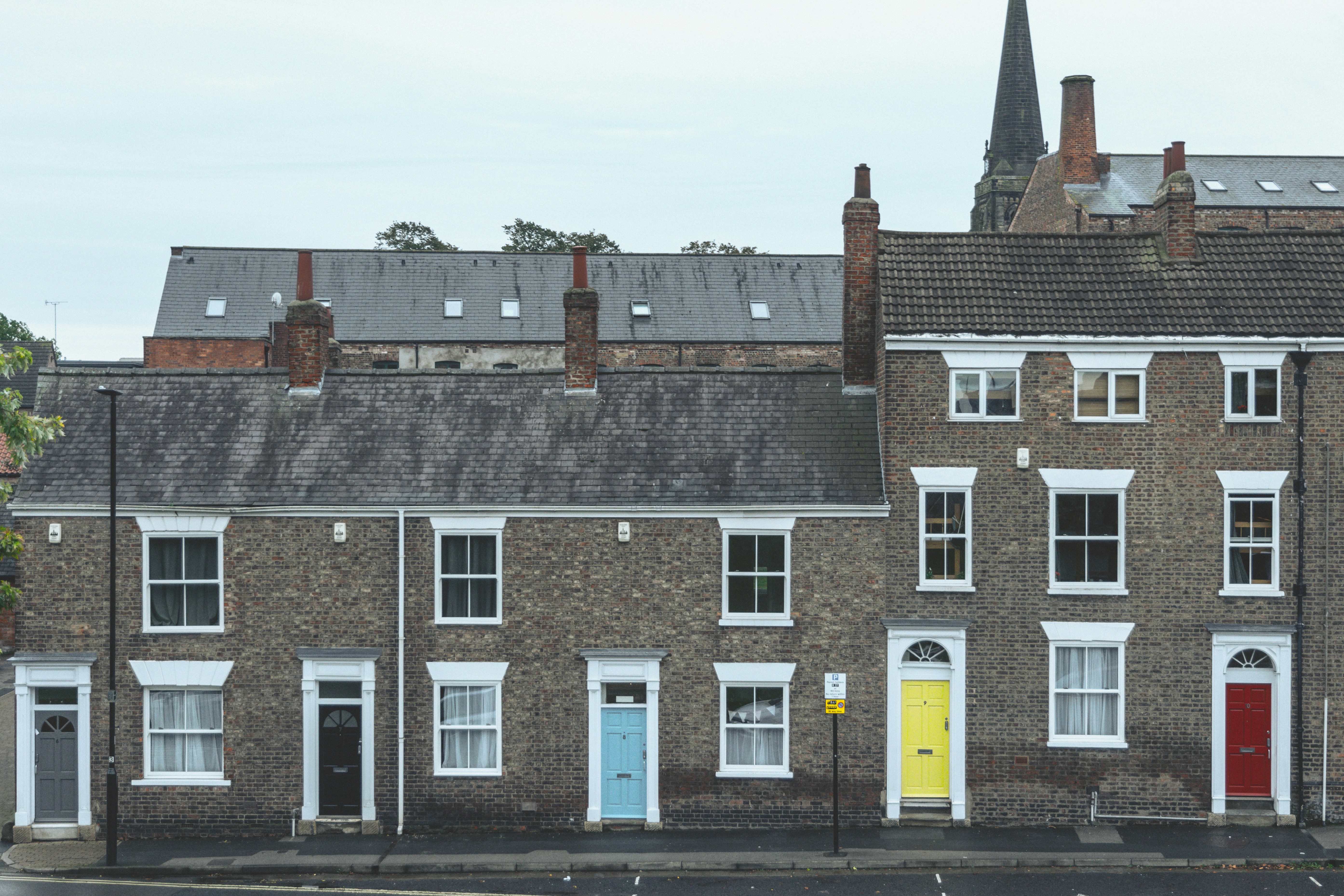 Brown and white Victorian terraced house exterior