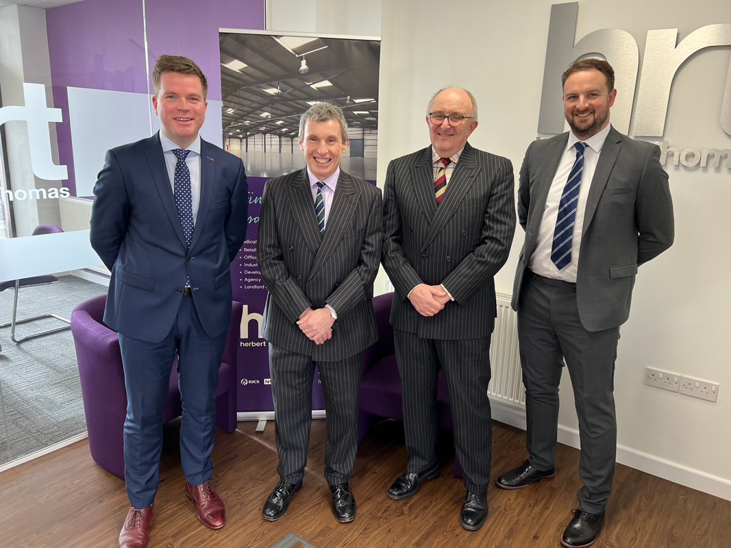 Rawlins and Madley Merger with Herbert R Thomas