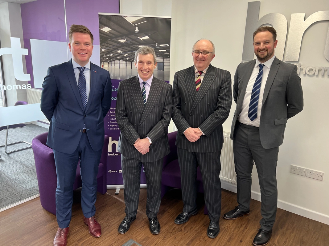 Rawlins and Madley Merger with Herbert R Thomas