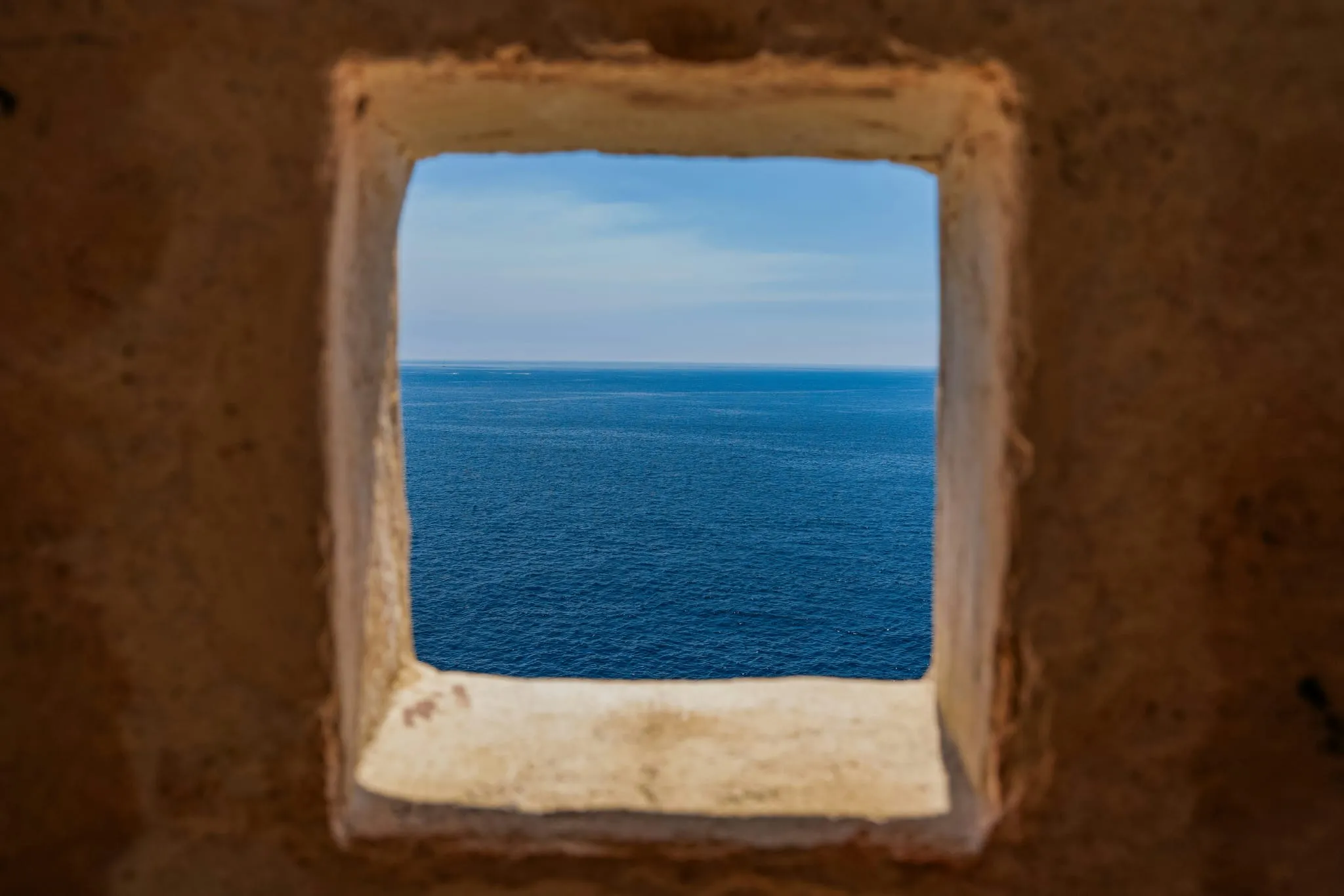 Window overlooking the calm sea