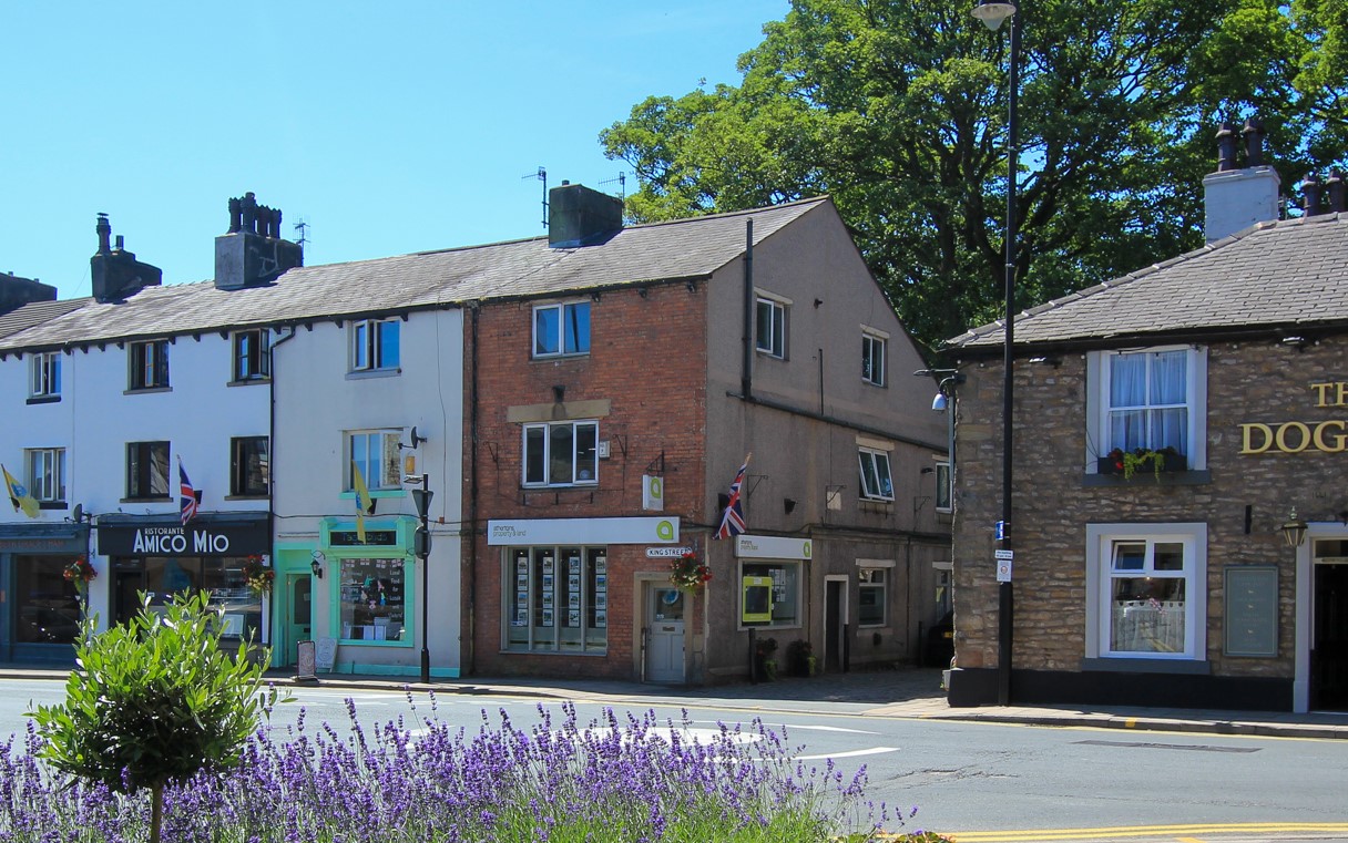 Professional surveyor conducting property valuation