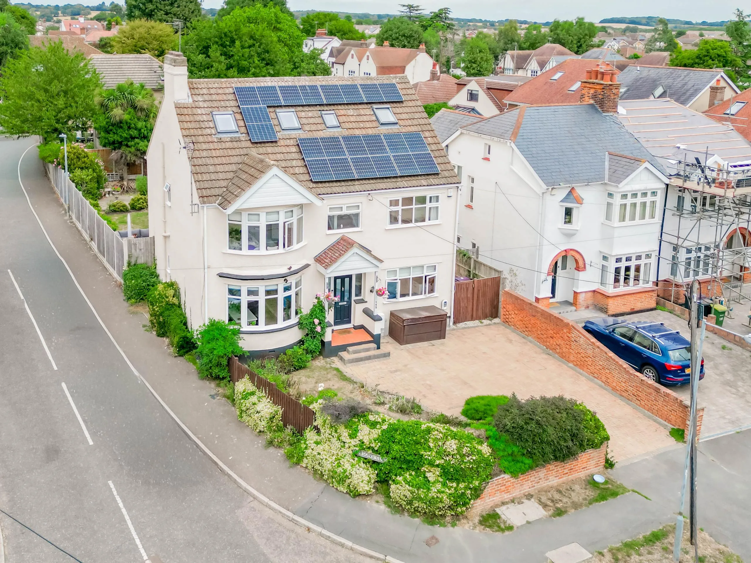 Aerial drone view of a residential property and surrounding area