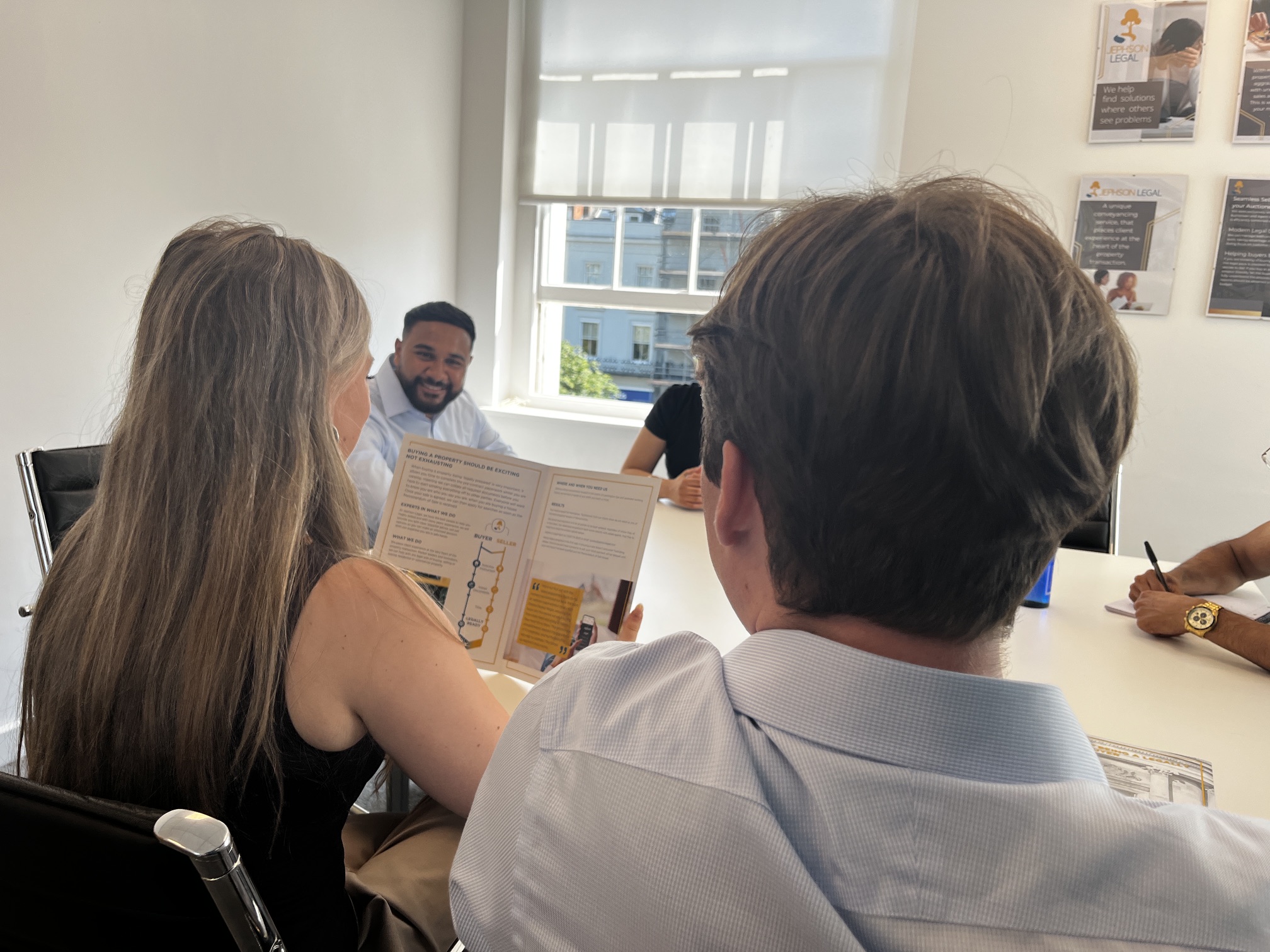 The Jephson Legal Team sit around a table discussing conveyancing