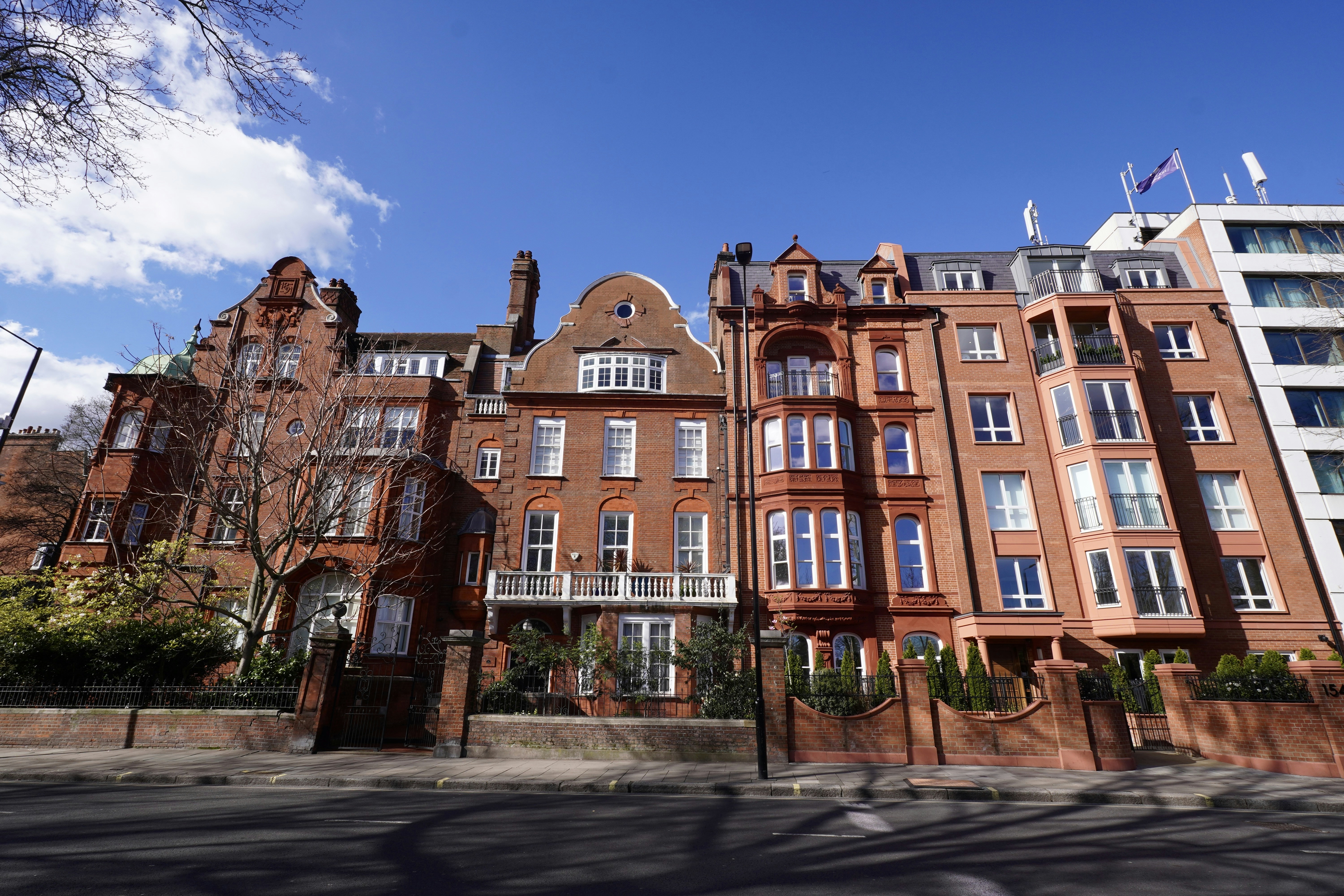 Red-brick Kensington townhouses on a London street