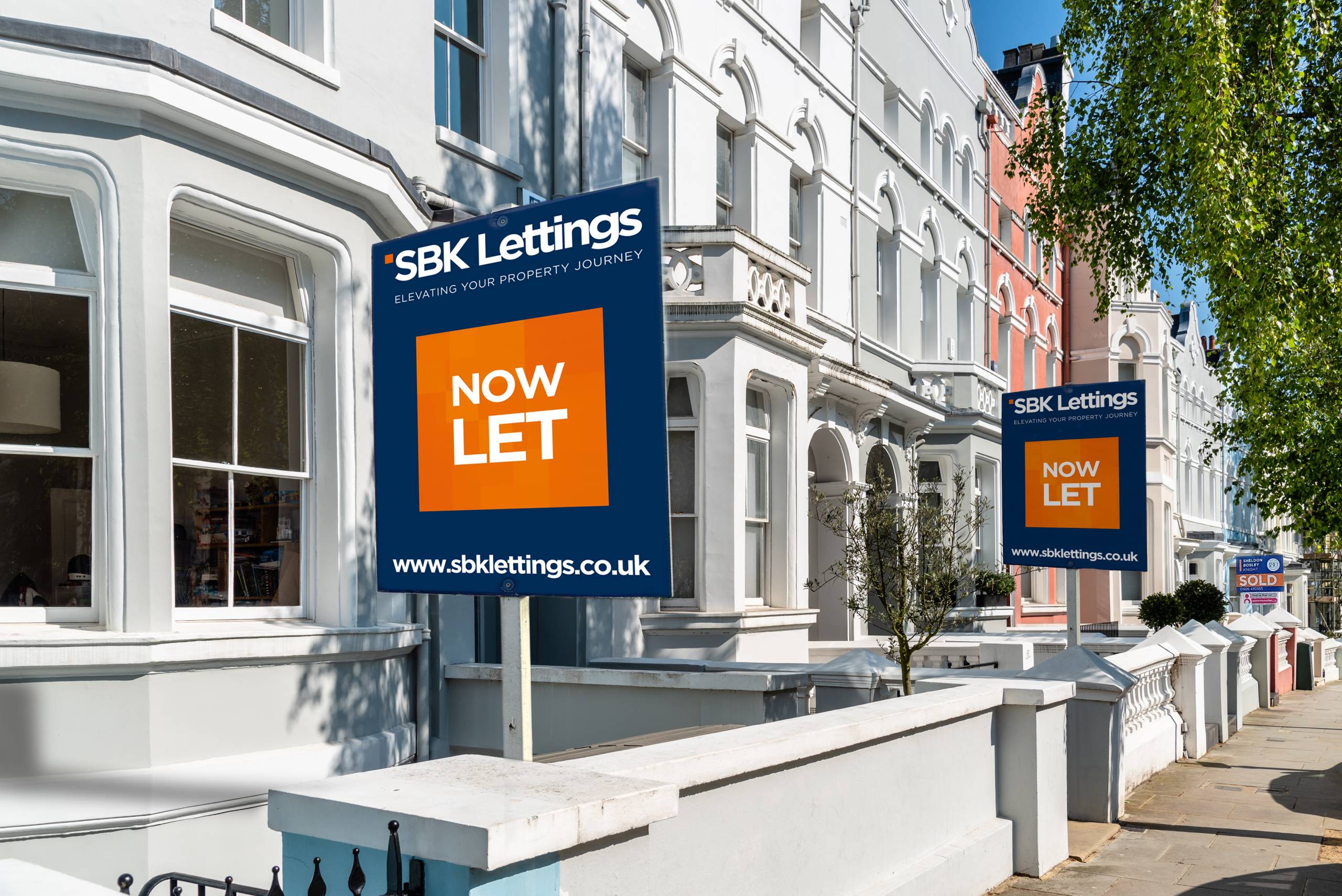 SBK Lettings signs showing Now Let outside a row of houses