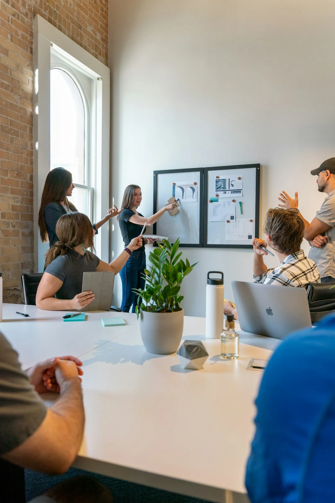 Professional estate agency team in a modern office meeting