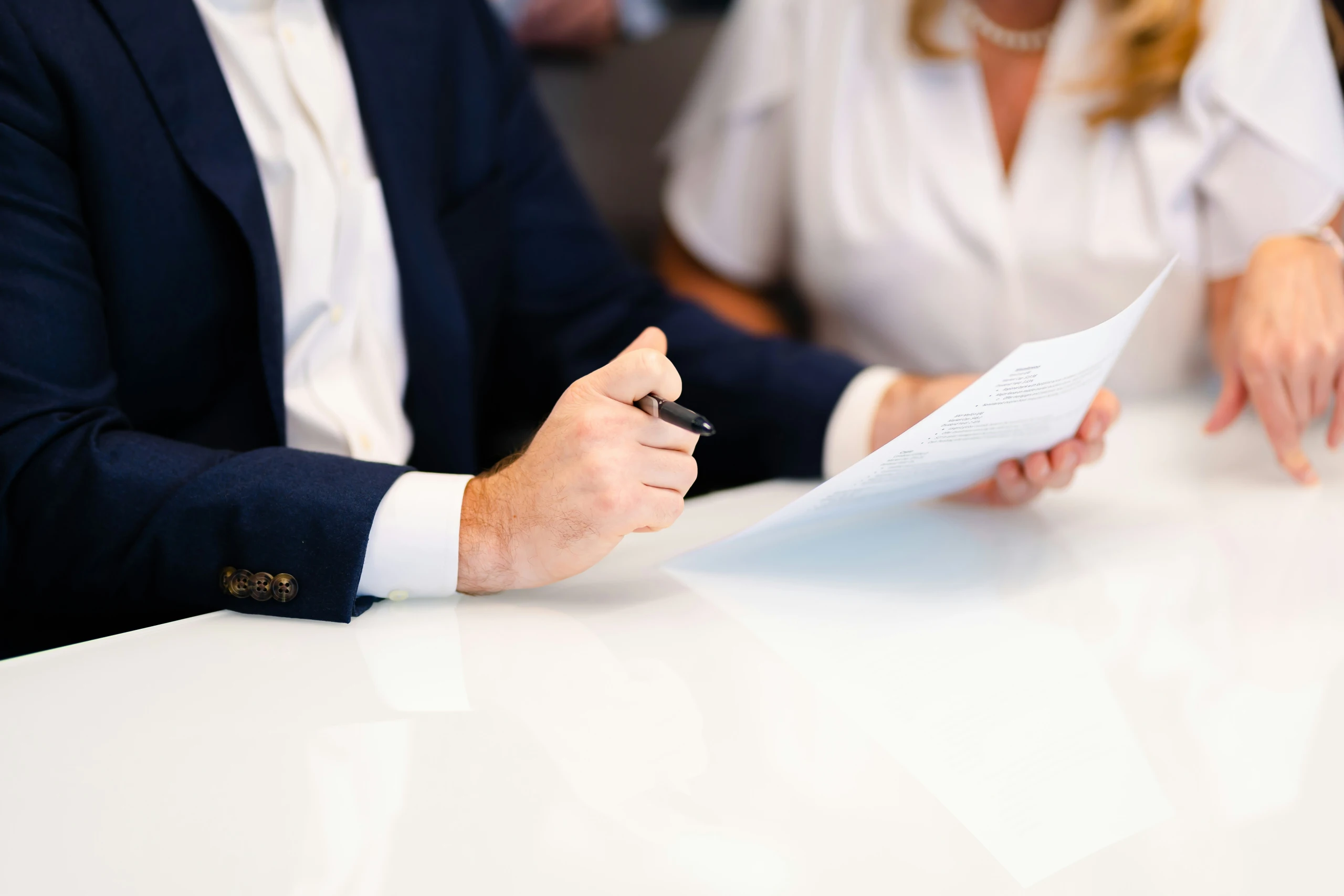A property consultant meeting with a client in a professional office setting