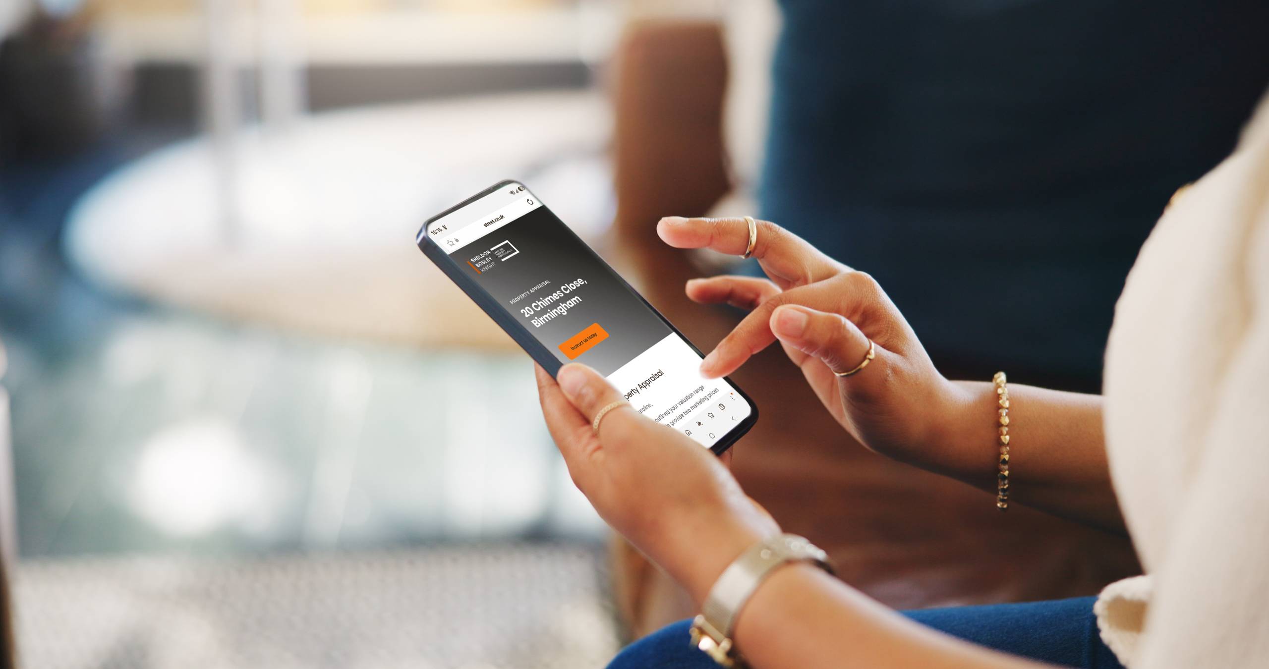 Someone using a mobile phone looking at an instant property report