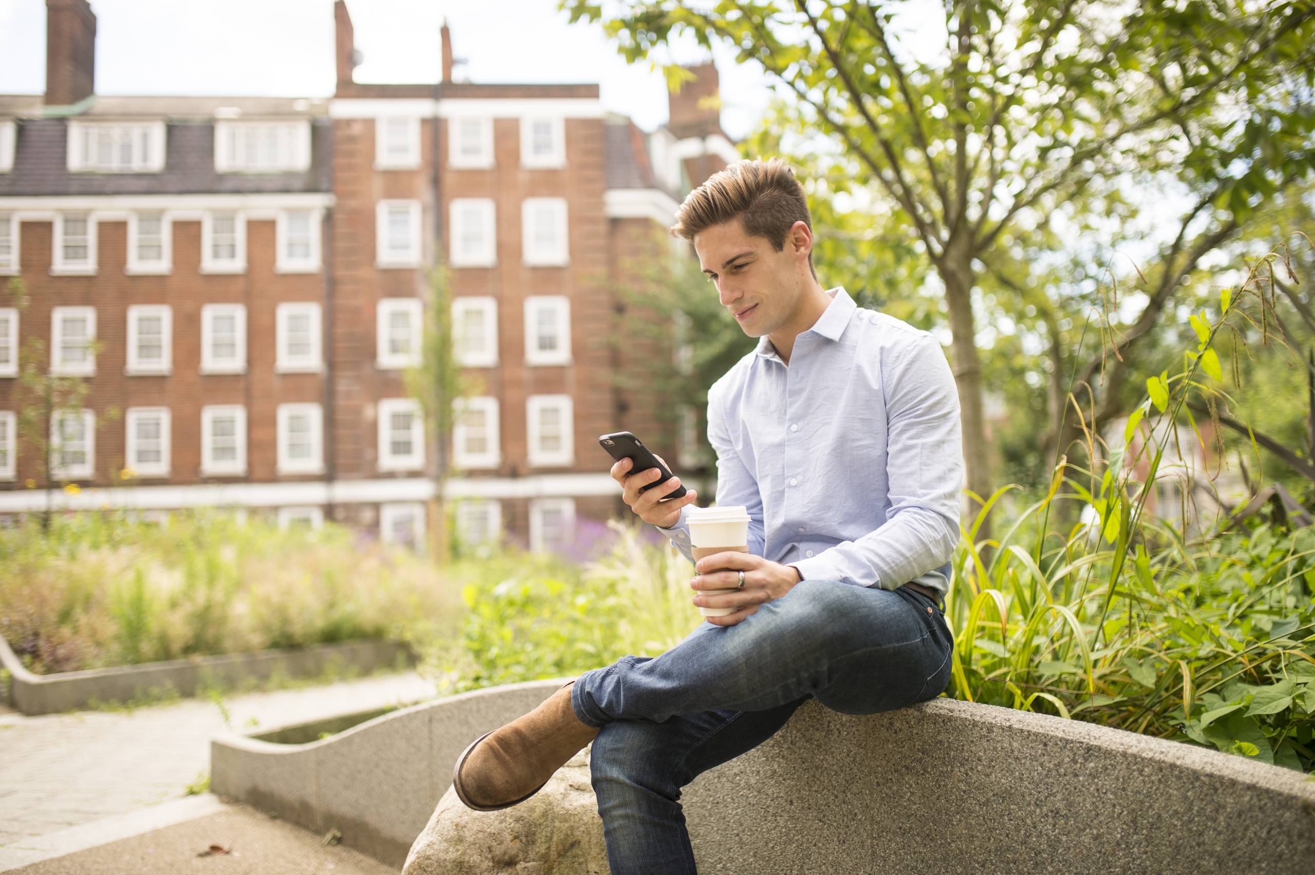 A customer checking their phone for updates while on the go