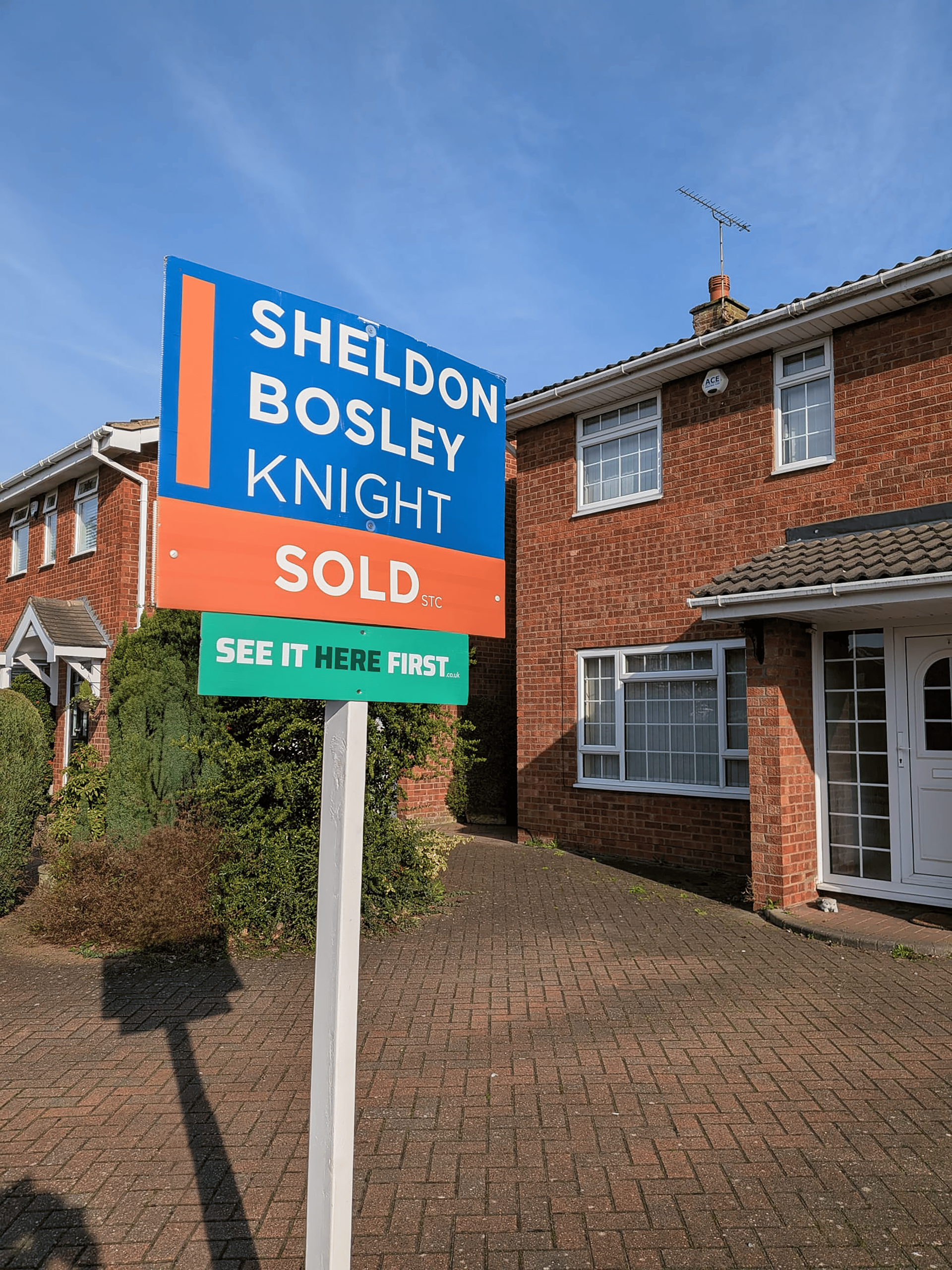 A sold board branded as Sheldn Bosley Knight outside a property