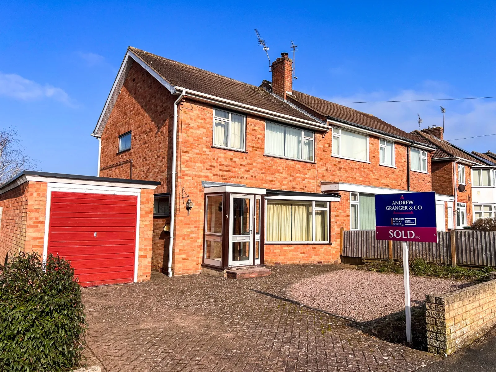 A house with an Andrew Granger Sold Board outside