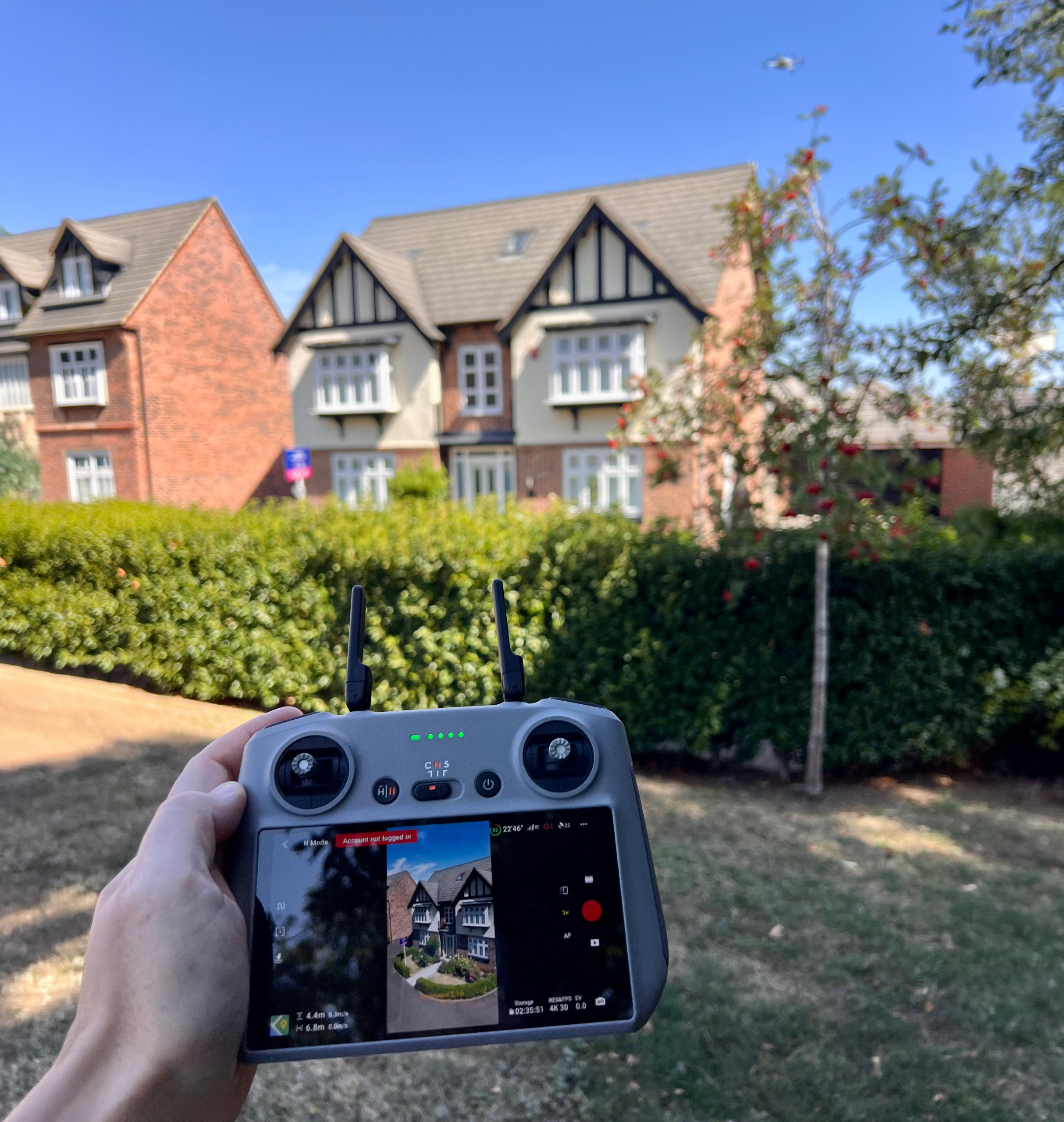 A drone operator taking property pictures