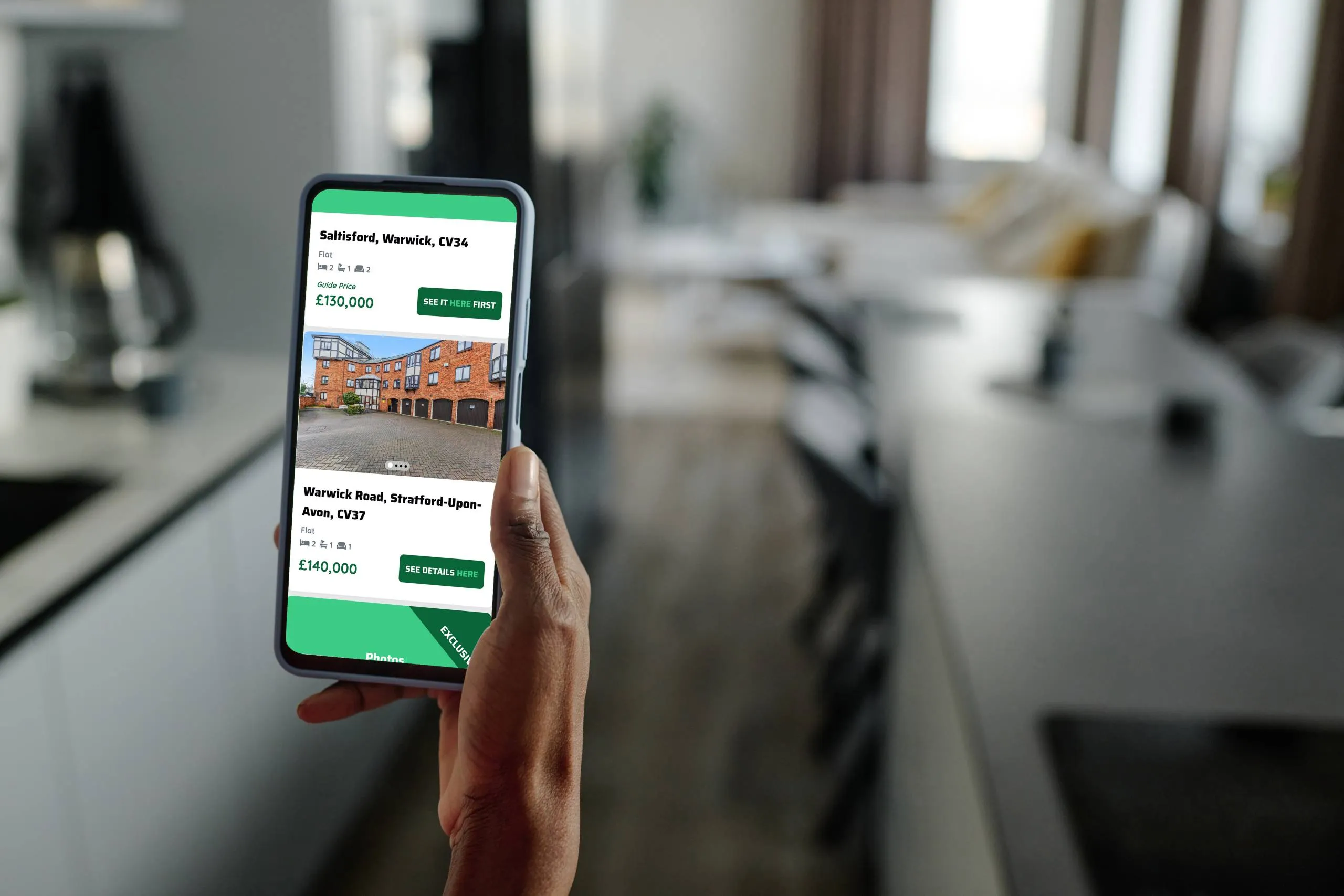 A smart phone showing available exclusive listings on the See It Here First property portal