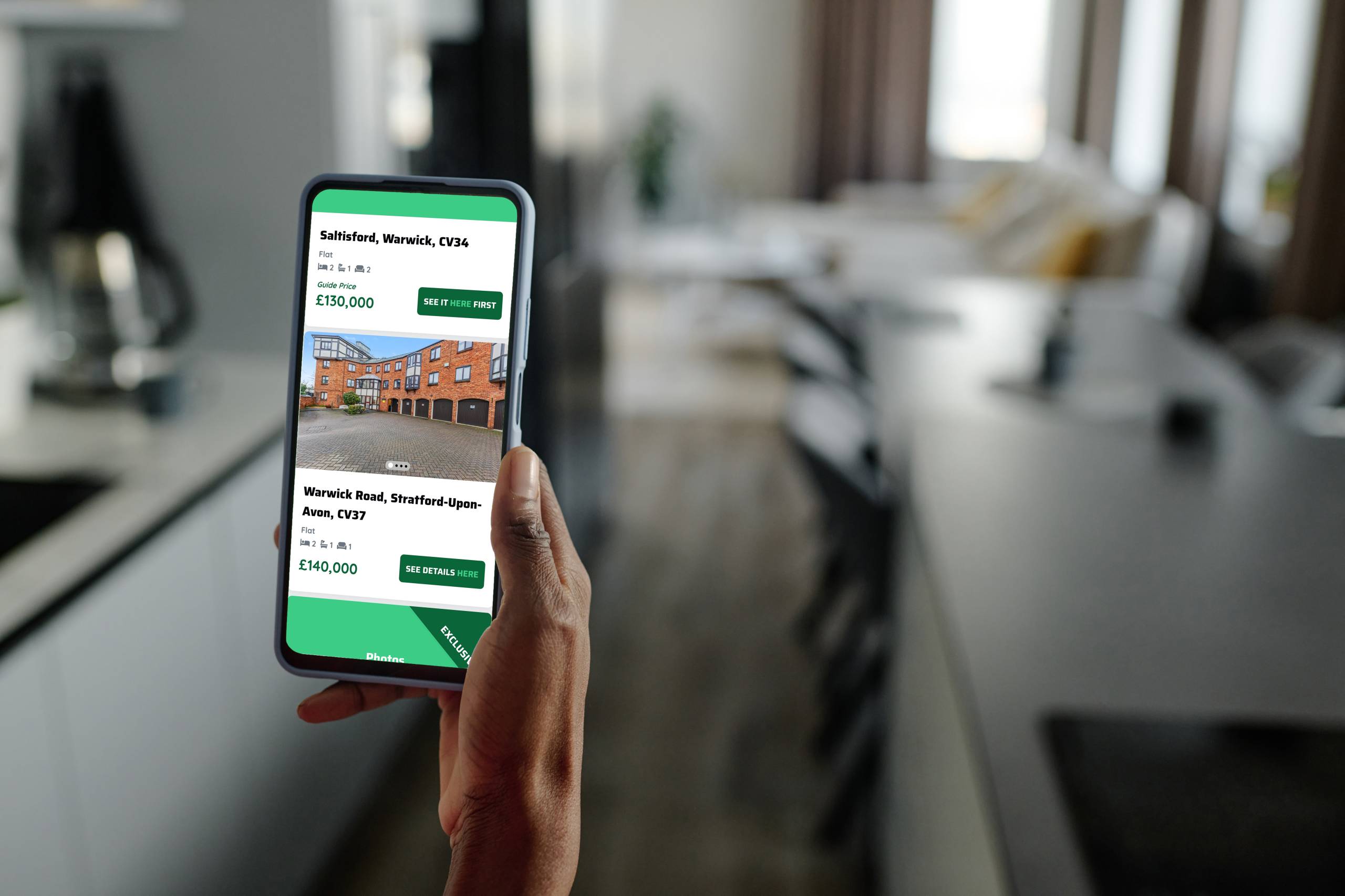A smart phone showing available exclusive listings on the See It Here First property portal
