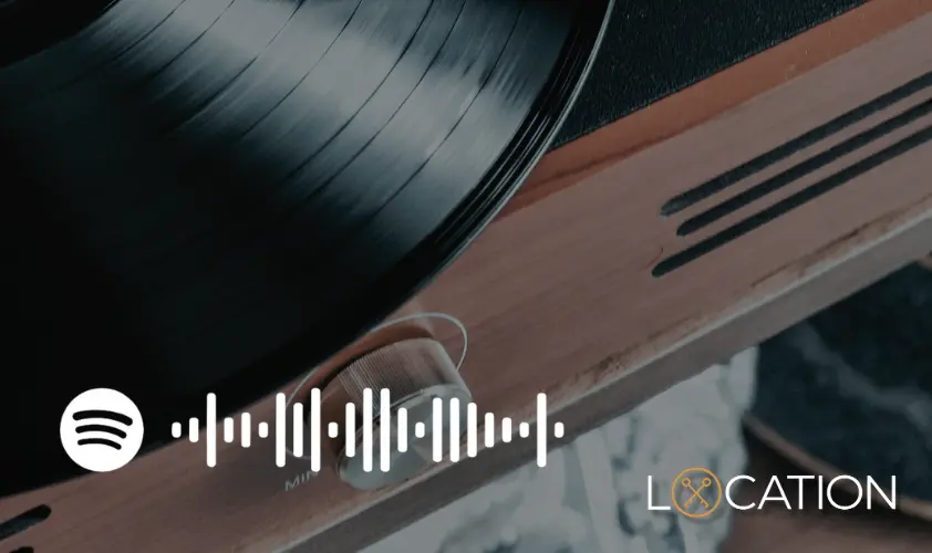 Spotify logo with sound wave graphic and Location branding, overlaid on image of vinyl record and guitar