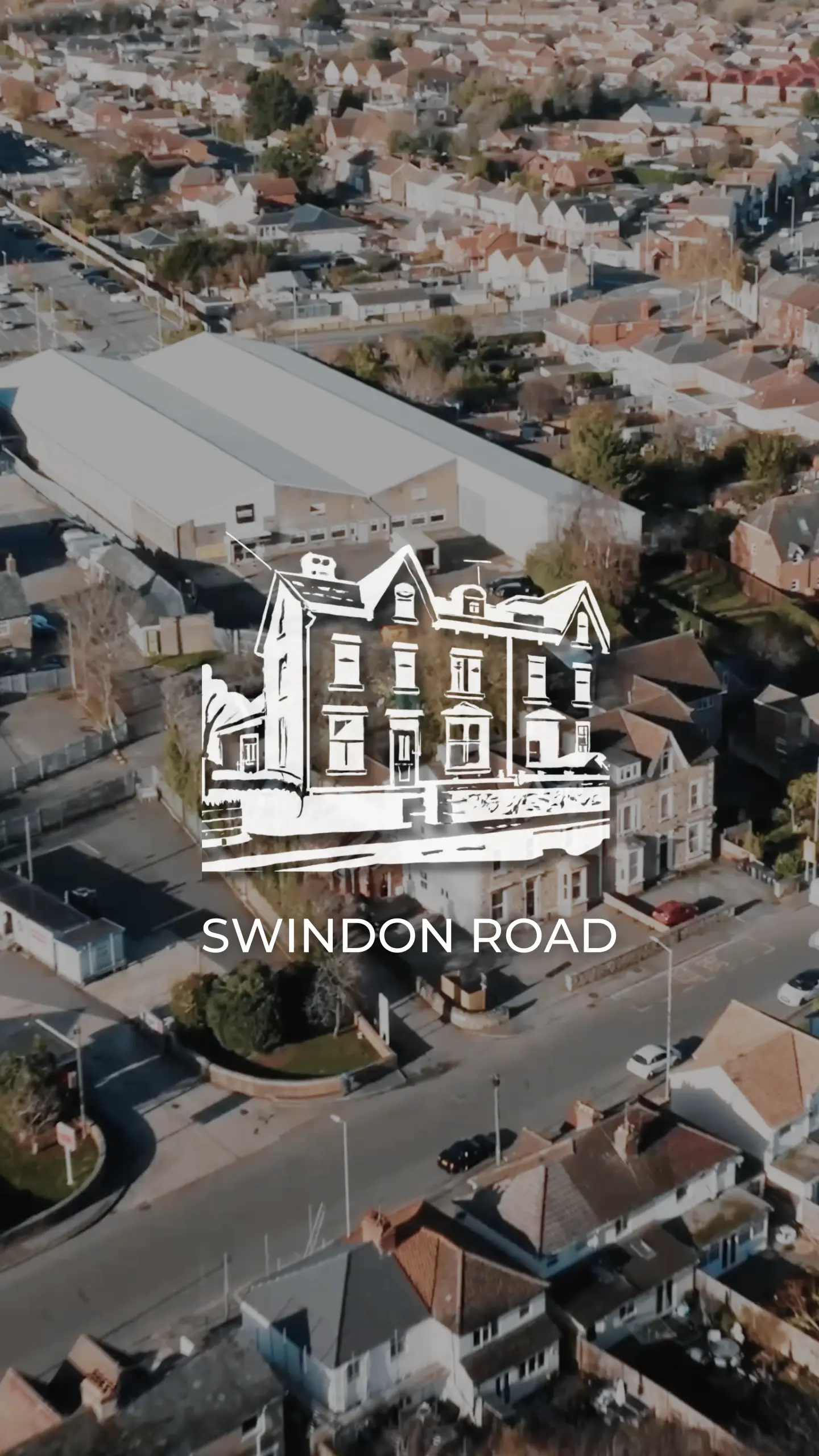 Aerial view of a residential street with a Victorian-style brick building highlighted with an illustrated overlay, labeled 'Swindon Road'