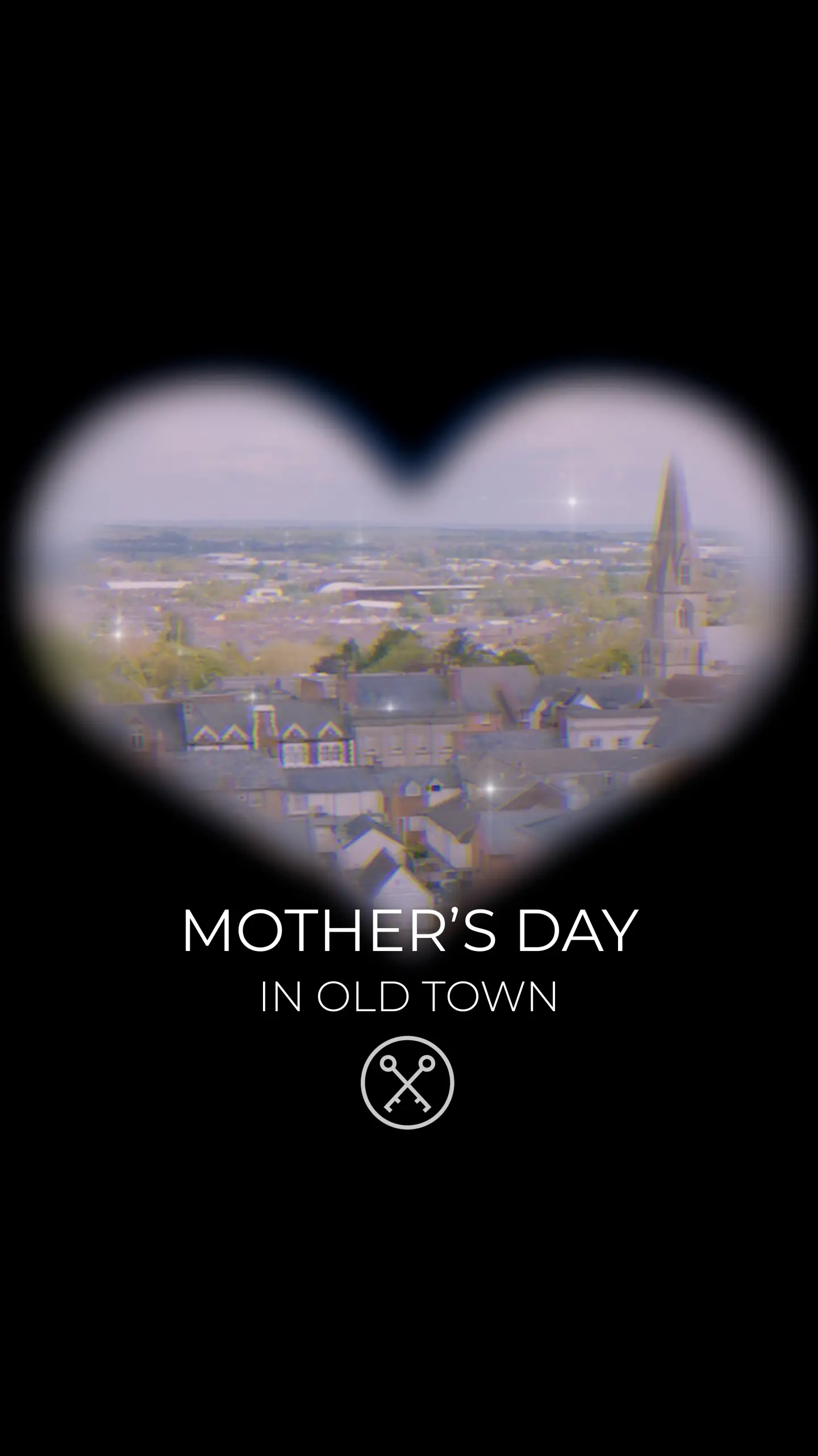Aerial view of a town with church spire framed in a heart shape, text reads 'Mother's Day in Old Town'