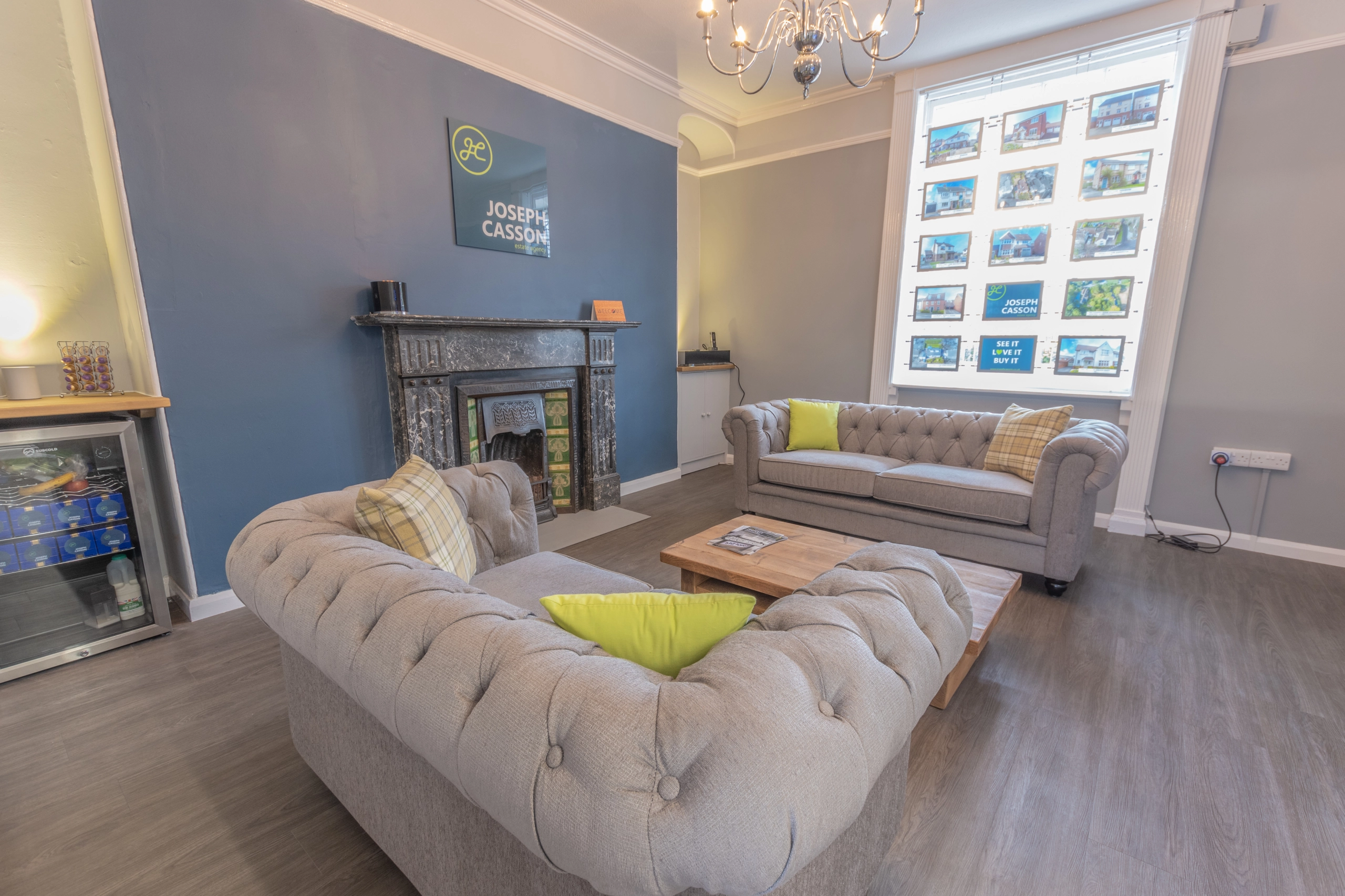 Joseph Casson estate agency logo with lime green stylised H in circle on dark teal background