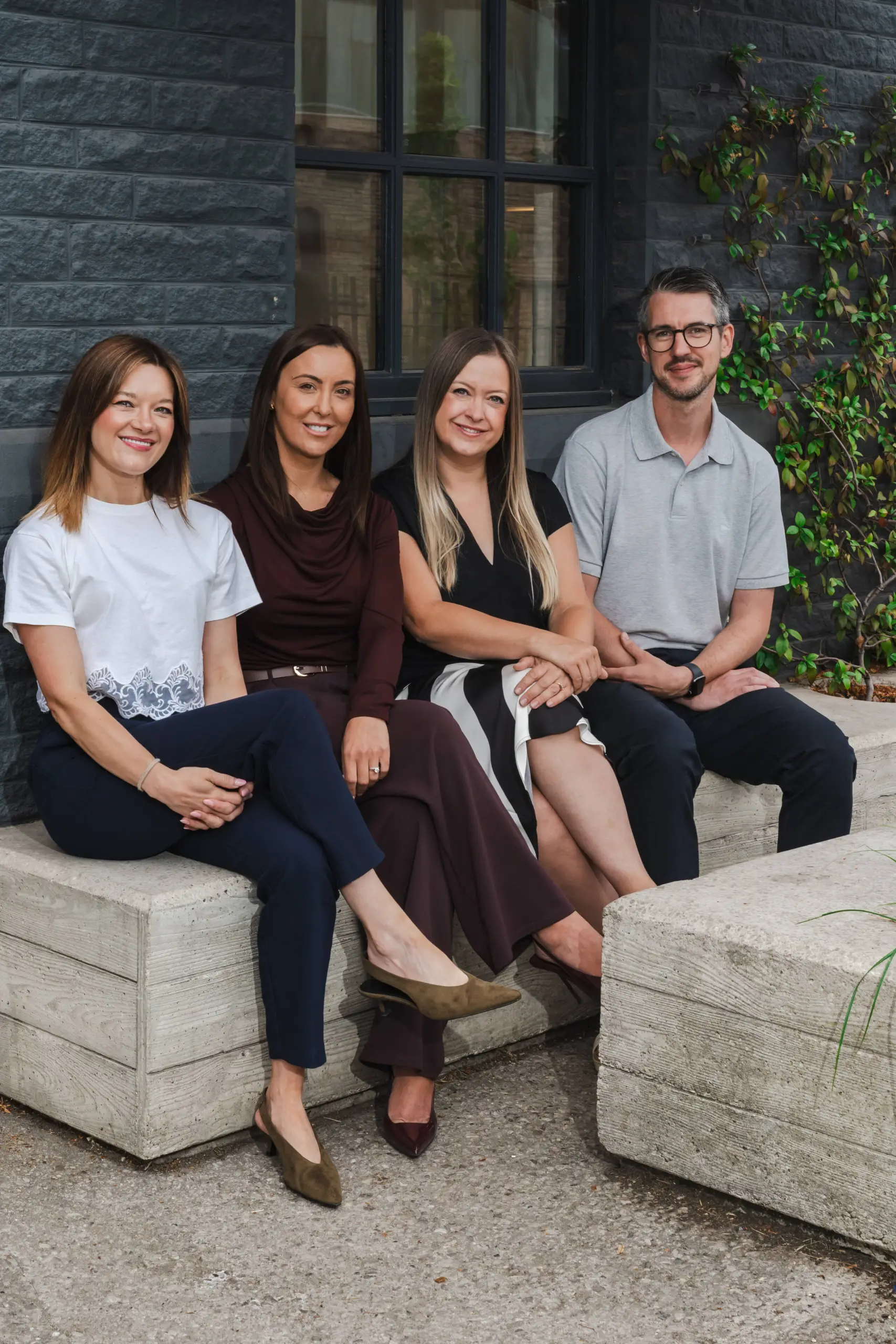 Redbrik Property Consultants sat on bench outside cafe