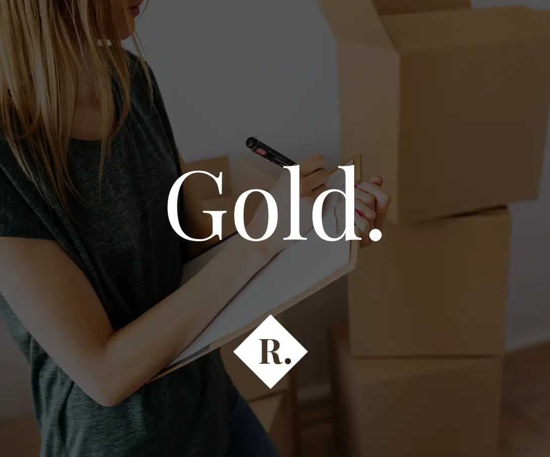 Person holding a tablet and stylus in an interior space, with text overlay reading "Gold." and logo "R."