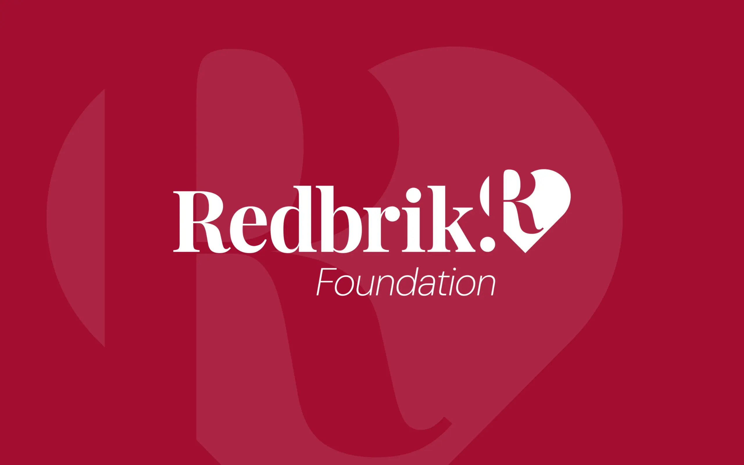 Redbrik Foundation logo on red background with heart shape
