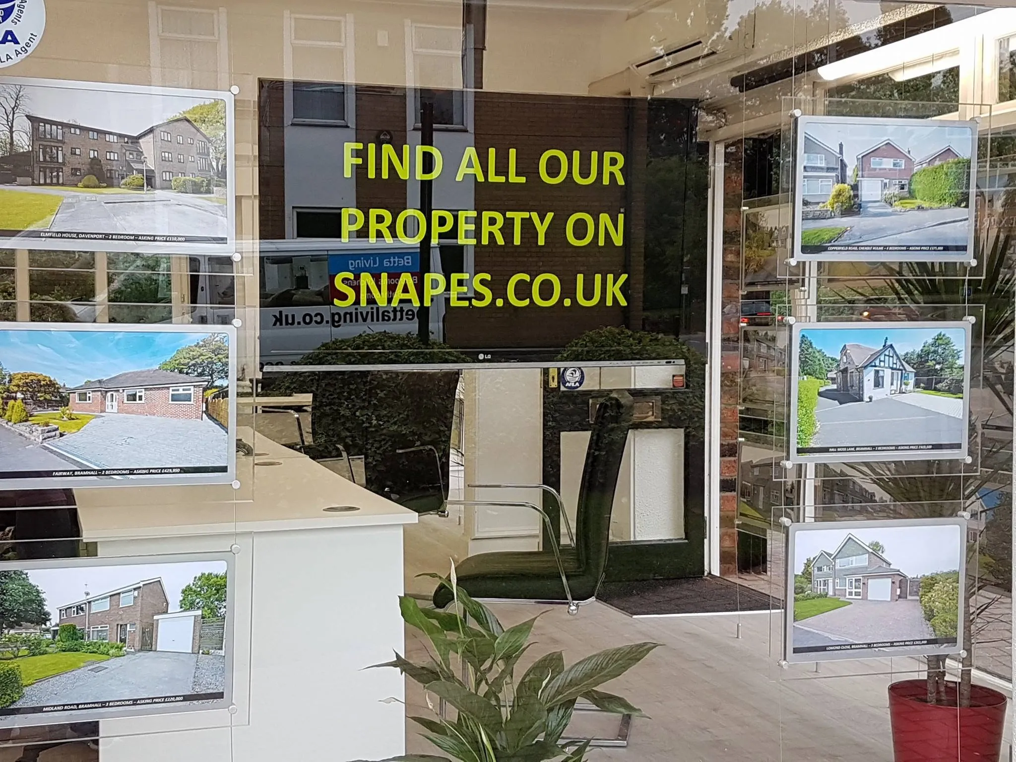 Picture of maple house window, our bramhall office.