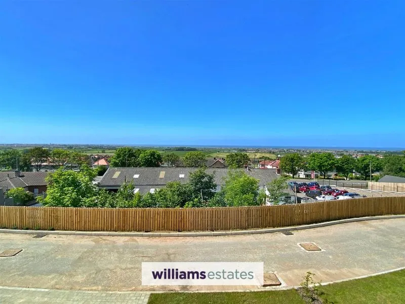 Saffron three-storey home at Saith, Meliden with open-plan kitchen and living area